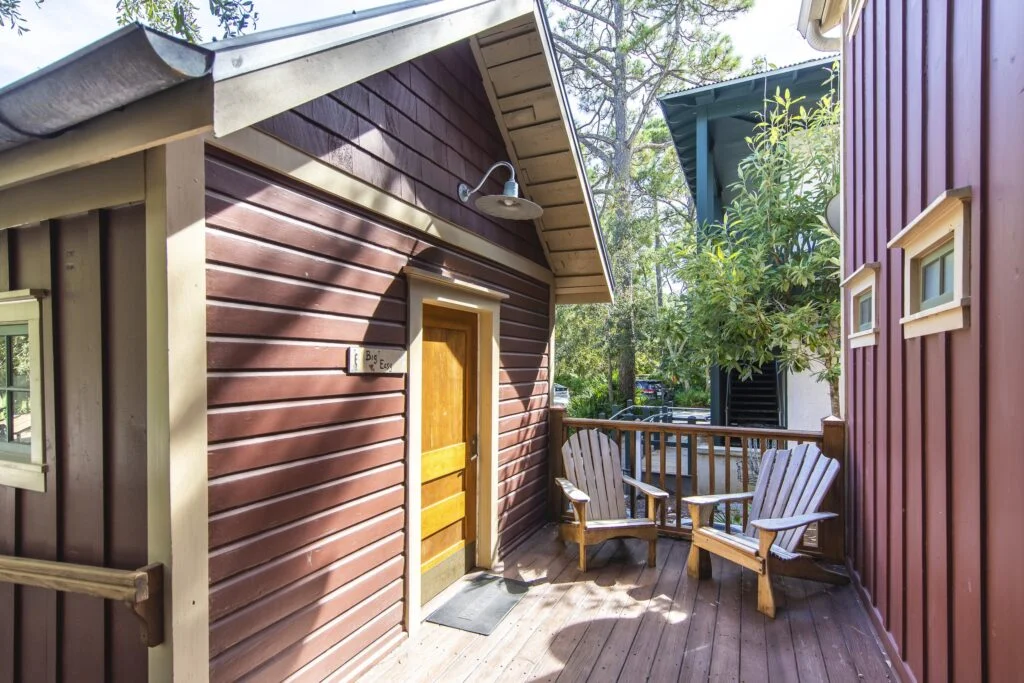 Big Easy has its own porch right outside it's front door. It features two chairs for comfortable seating.