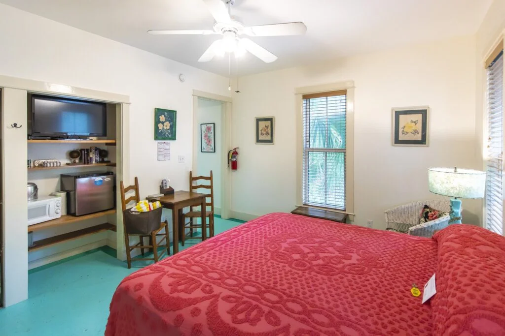 The Hibiscus Rooms bed from another angle. Aswell as more framed Hibiscus textiles and paintings.