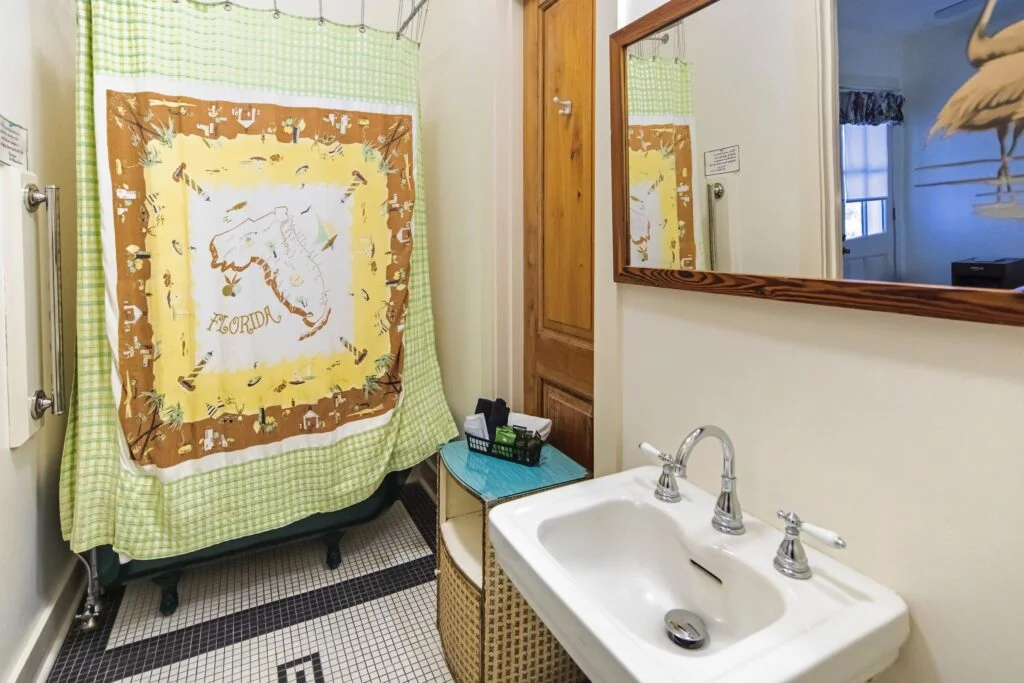 Turner has a clawfoot tub and shower combo. Covered with a vintage shower curtain.
